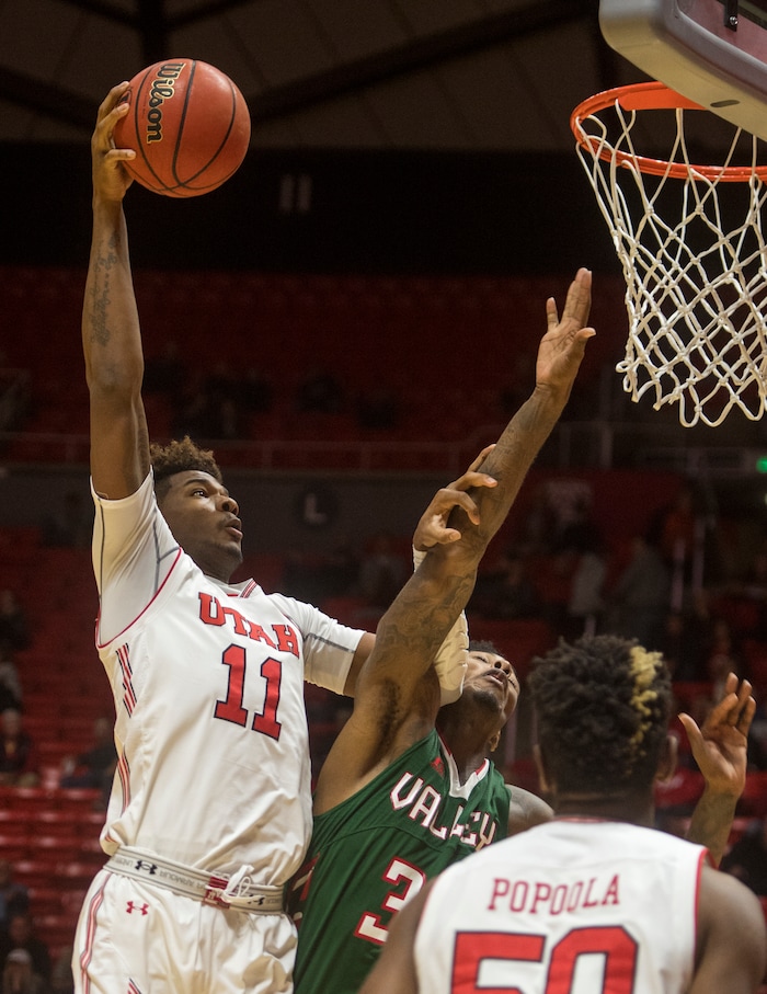 (Rick Egan  |  The Salt Lake Tribune)  Utah Utes forward Chris Seeley (11) dunks the ball over Mississippi Valley State Delta Devils center Jamal Watson (33), in basketball action Utah Utes vs. Mississippi Valley State Delta Devils, at the Jon M. Huntsman Center,  Monday, November 13, 2017.