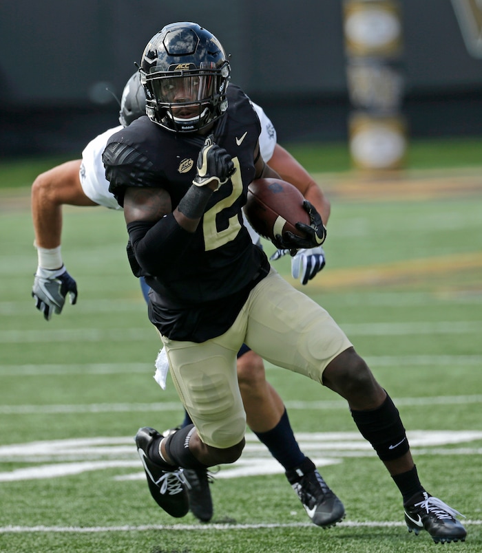 Wake Forest's Cameron Glenn (2) returns an interception against Utah State in the first half of an NCAA college football game in Winston-Salem, N.C., Saturday, Sept. 16, 2017. (AP Photo/Chuck Burton)
