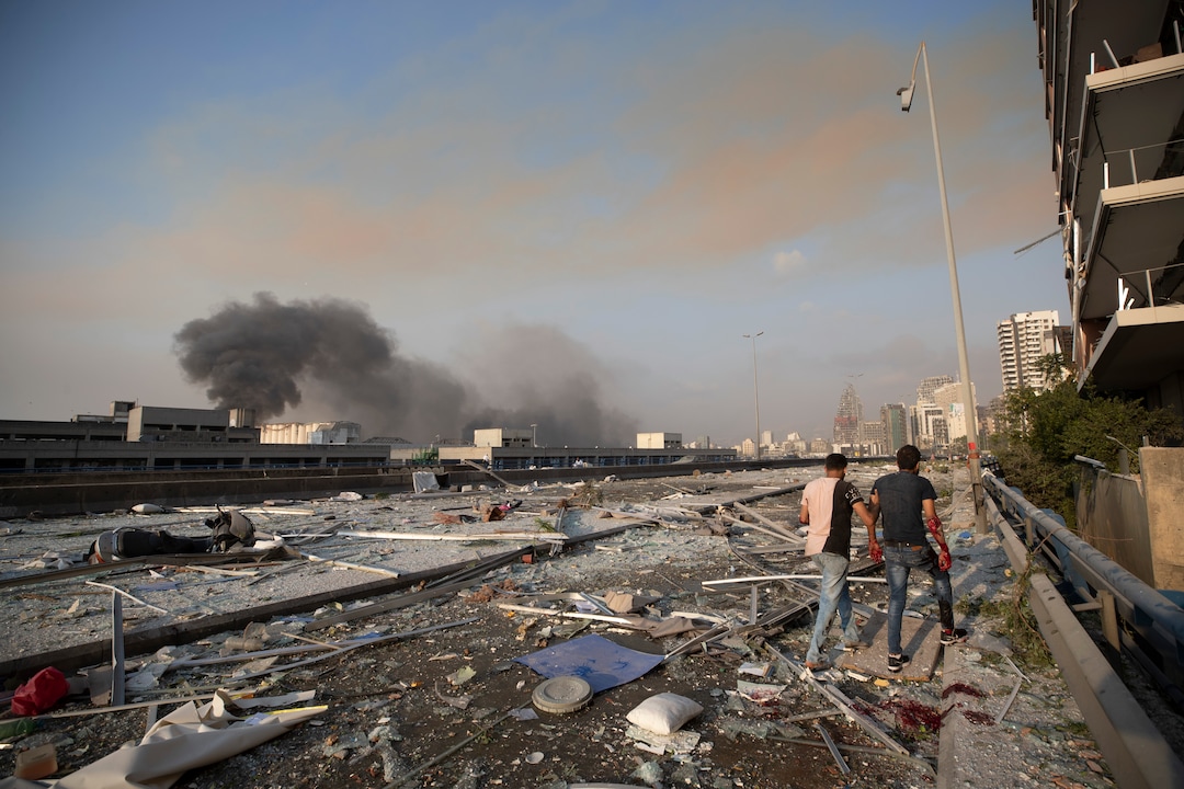 Aftermath of a massive explosion is seen in in Beirut, Lebanon, Tuesday, Aug. 4, 2020. Massive explosions rocked downtown Beirut on Tuesday, flattening much of the port, damaging buildings and blowing out windows and doors as a giant mushroom cloud rose above the capital. Witnesses saw many people injured by flying glass and debris. (AP Photo/Hassan Ammar)