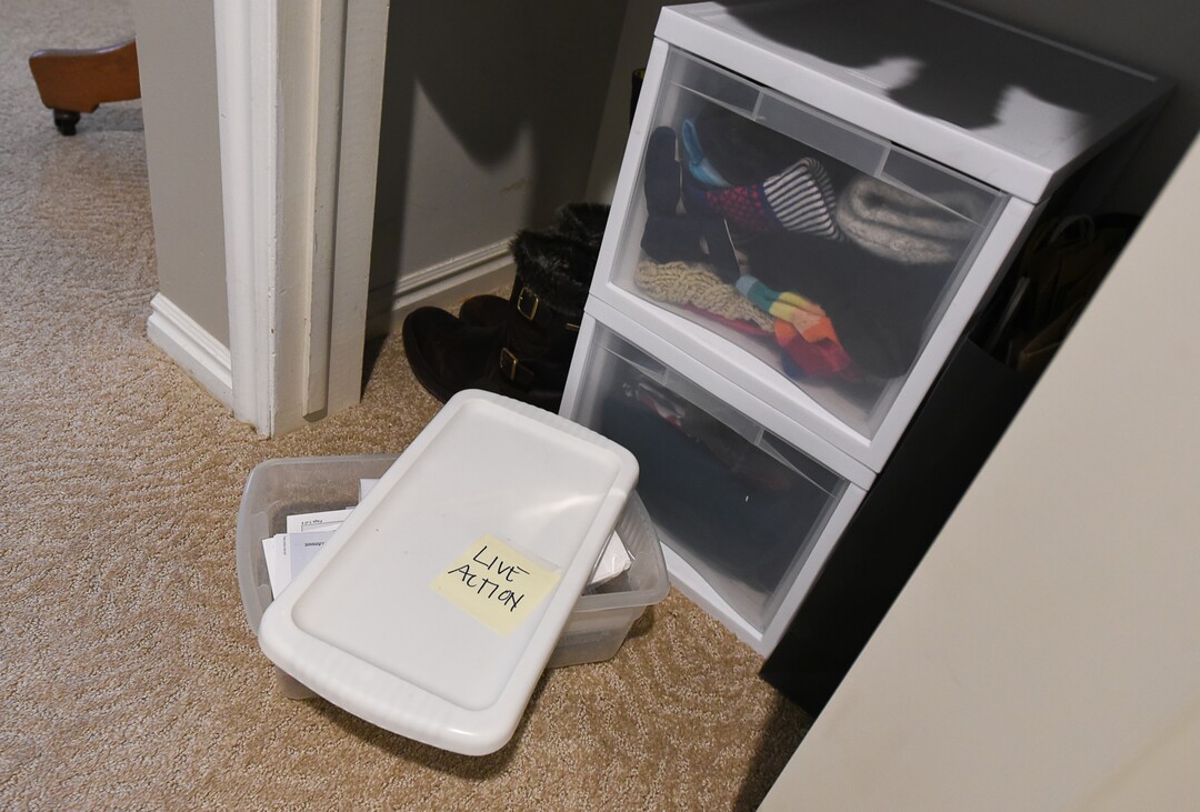 (Francisco Kjolseth  |  The Salt Lake Tribune)  A closet has been paired down significantly by Blair Tomten, who has been using the Kondo method to tidy up her home in Millcreek, after she started using the process four years ago after being inspired by the minimalism approach to tackling your stuff category by category as opposed to room by room. A plastic bin holds the "live action" items that are in the process of being dealt with. 
