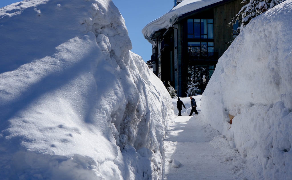 (Francisco Kjolseth | The Salt Lake Tribune) Deep channels are cut into the snowpack for the sidewalks above Park City on Thursday, March 16, 2023.