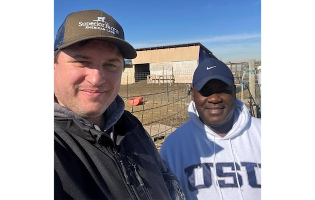 (Joseph Okoh) Chad Page, left, and Joseph Okoh, of Utah State University’s Department of Animal, Dairy and Veterinary Sciences, at Utah Refugee Goats in Salt Lake City.
