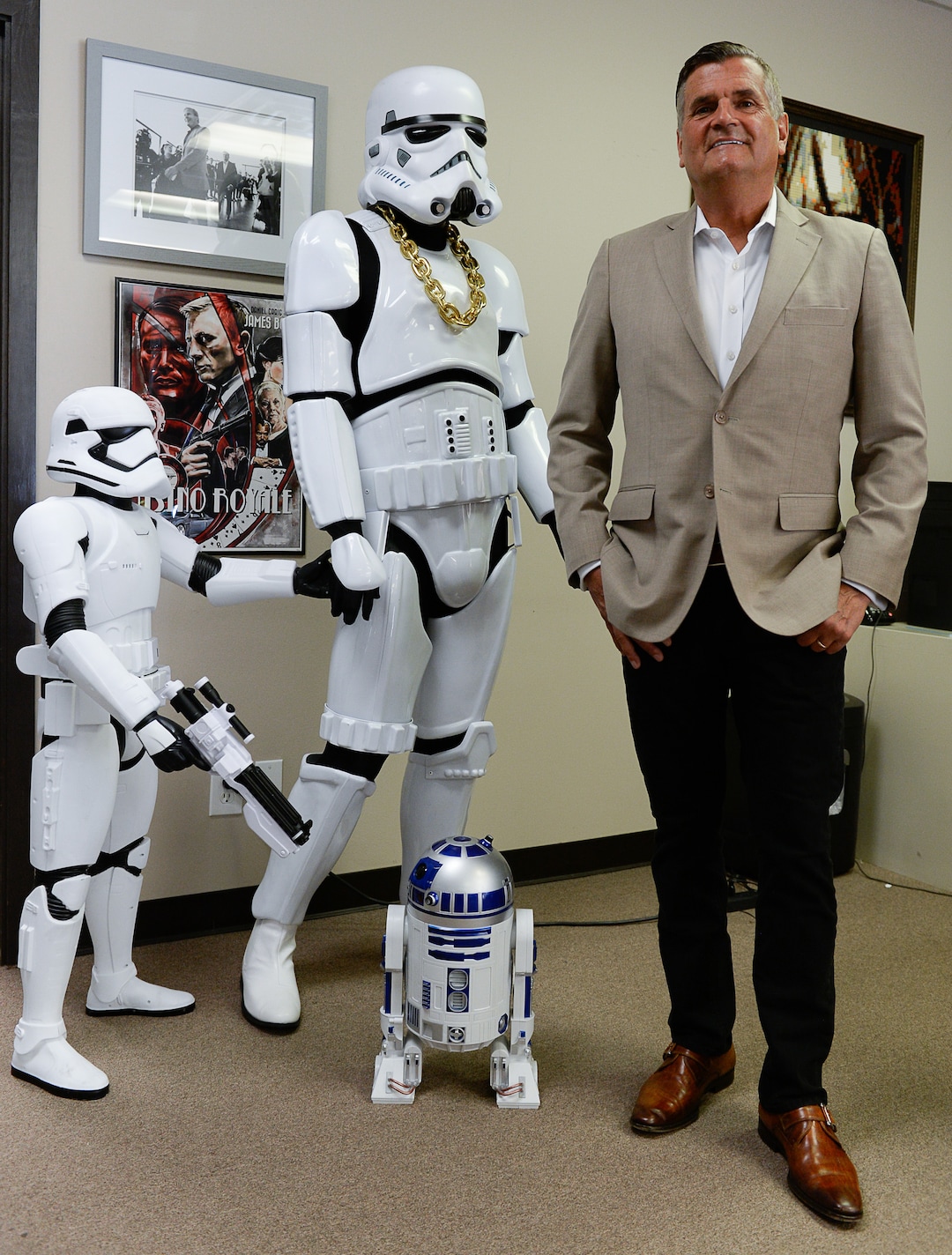 (Francisco Kjolseth  |  The Salt Lake Tribune)  Bryan Brandenburg, co-founder of Salt Lake Comic Con shows his sense of humor by standing by one of his assembled family scenes at the offices in Salt Lake City. 
