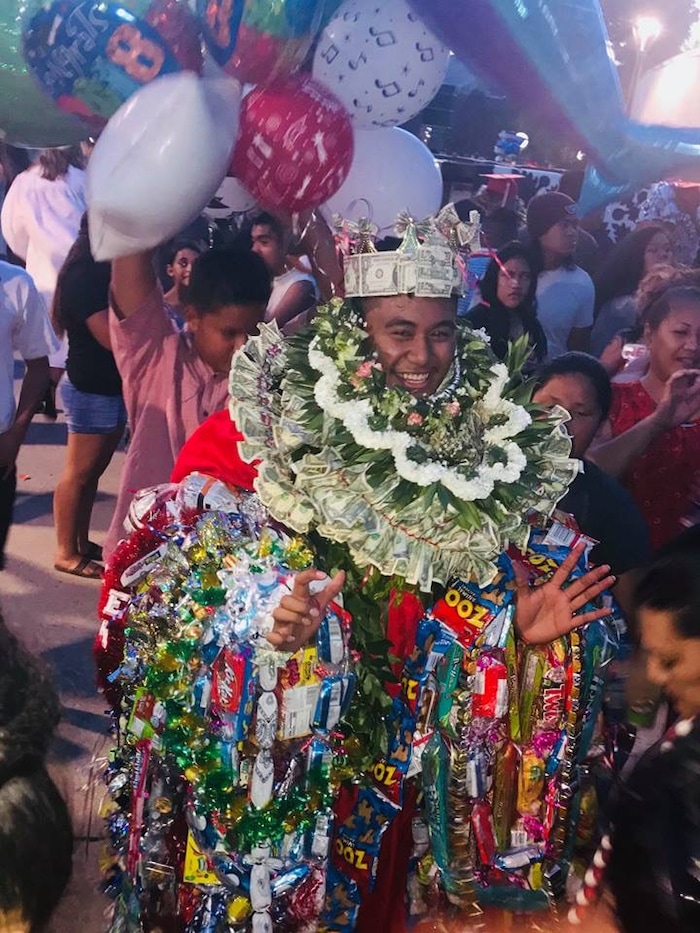 (Courtesy of M. Vida Hafoka) Taavili PO Hafoka graduated from East High School in Salt Lake City on Wednesday, June 6, 2018. He has South Pacific heritage but was banned from wearing leis during his ceremony at the Huntsman Center. Pacific Islander students, when allowed, typically wear one or two fresh leis during their graduation to honor their heritage. Relatives then pile more on after the ceremony, in celebration.