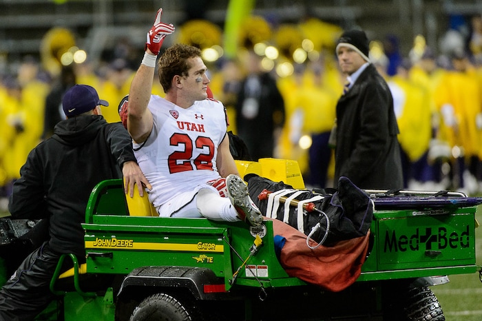Trent Nelson  |  The Salt Lake Tribune
Utah's Chase Hansen (22) is taken from the field following the game as the University of Utah faces the University of Washington, NCAA football at Husky Stadium in Seattle, Saturday November 7, 2015.
