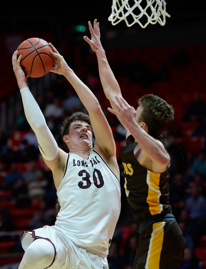 (Francisco Kjolseth  |  The Salt Lake Tribune)  Davis vs Lone Peak, 6A State high school basketball tournament at the Huntsman Center in Salt Lake City, Thursday March 1, 2018. Jackson Brinkerhoff (3) goes up against Josh Sanders (5). 