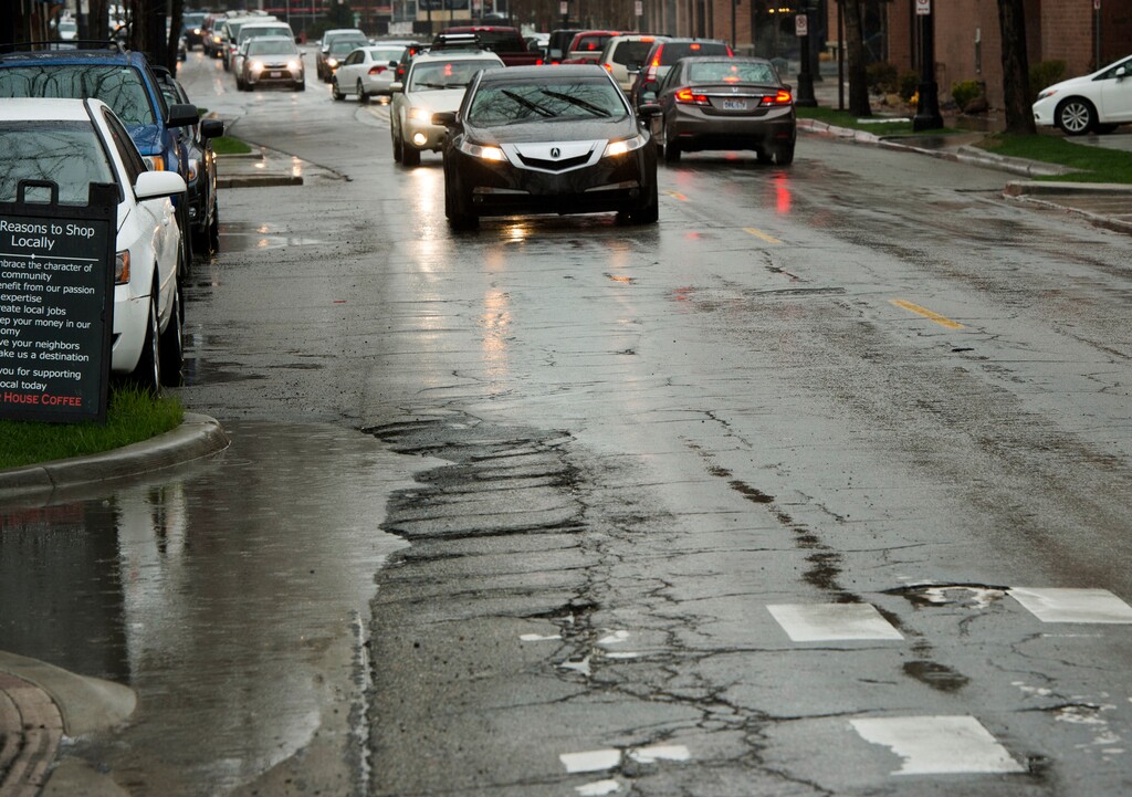 (Rick Egan  |  Tribune file photo)

Potholes on 1100 East between Hollywood Ave and 2100 South Monday, March 28, 2016.