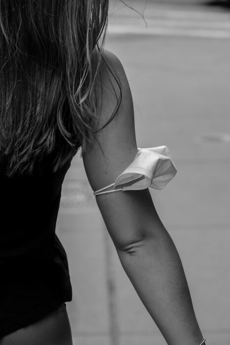 (Jordan Gale | The New York Times)
A person carries their mask around their arm in Manhattan, May 24, 2021. The debate over reopening has largely been settled in favor of the reopeners. But the debate over the wisdom of reopening and unmasking hasn't gone away, Ross Douthat writes.