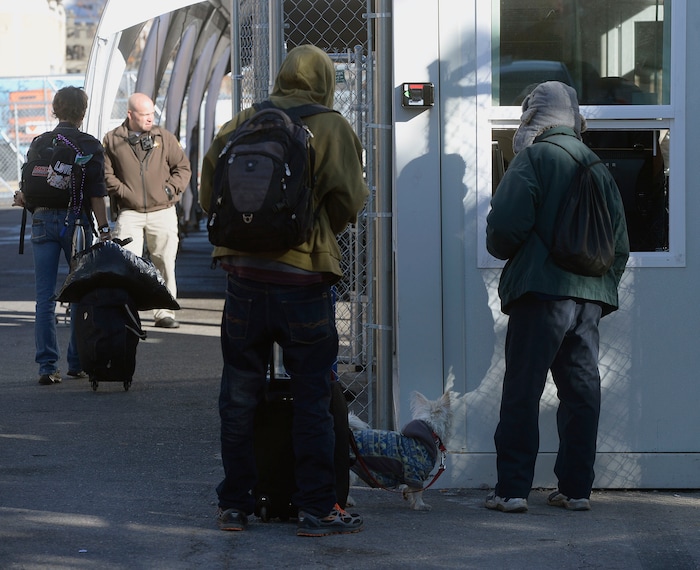 (Al Hartmann | The Salt Lake Tribune)
Starting Friday Oct. 27 homeless check in at booth at right to have their coordinated services card scanned before passing into the "safe space" courtyard outside the Road Home shelter. Security provided by the Utah Highway Patrol. The area is accessible from the south on Rio Grand Street. The area to the north at 200 South and Rio Grand is fenced and locked.