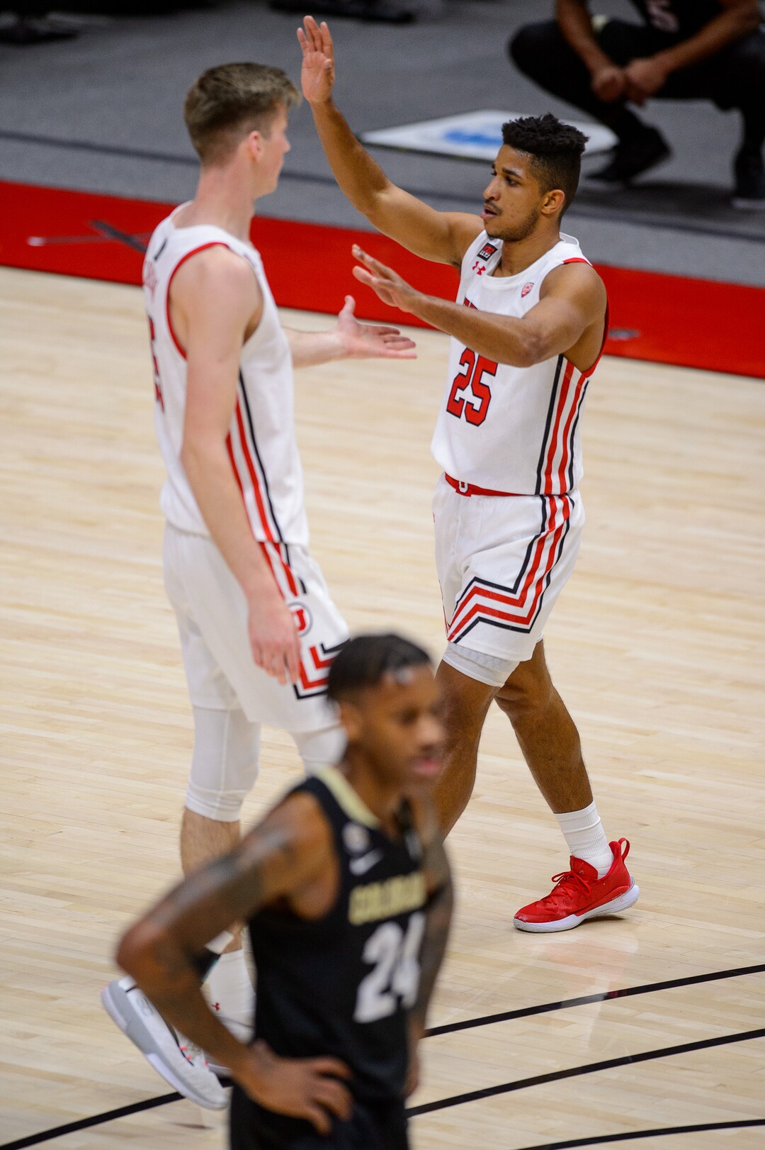 (Trent Nelson  |  The Salt Lake Tribune) Utah Utes guard Alfonso Plummer (25) and Utah Utes center Branden Carlson (35) celebrate a score as Utah hosts Colorado, NCAA basketball in Salt Lake City on Monday, Jan. 11, 2021.