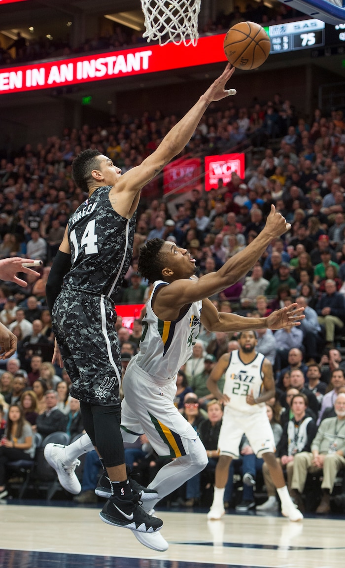 (Rick Egan  |  The Salt Lake Tribune)   Utah Jazz guard Donovan Mitchell (45) takes the ball to the hoop, as San Antonio Spurs guard Danny Green (14) defends, in NBA action, in Salt Lake City, Monday, February 12, 2018.