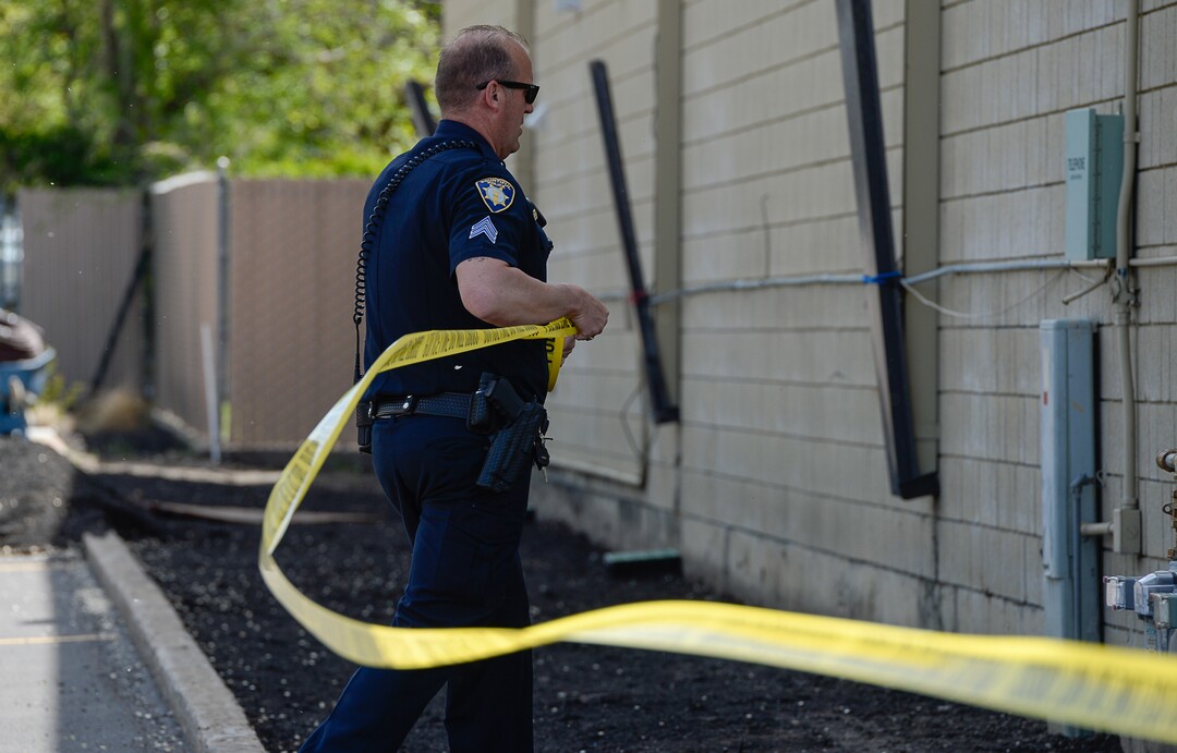 (Francisco Kjolseth  |  The Salt Lake Tribune)  Police work the scene of a shooting at Pawn and Sales, 135 S. and 500 West, in Bountiful on Friday, May 4, 2018, where two men attempted to rob the store. One suspect was killed in a "scuffle" with a staff member while the other one fled the scene.