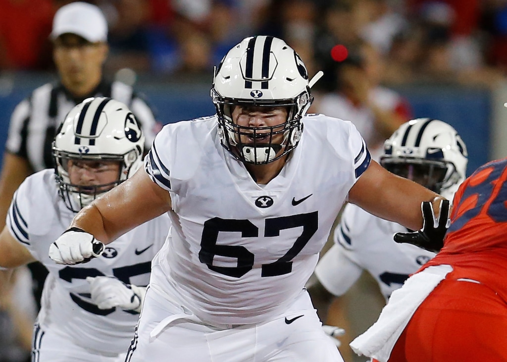 FILE - Brigham Young offensive lineman Brady Christensen (67) is shown in action in the first half during an NCAA college football game against Arizona in Tucson, Ariz., in this Saturday, Sept. 1, 2018, file photo. Christensen was selected to The Associated Press All-America first-team offense, Monday, Dec. 28, 2020. (AP Photo/Rick Scuteri)