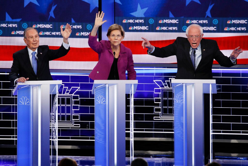 (John Locher | AP) From left, Democratic presidential candidates, former New York City Mayor Mike Bloomberg, Sen. Elizabeth Warren, D-Mass.; and Sen. Bernie Sanders, I-Vt., participate in a Democratic presidential primary debate Wednesday, Feb. 19, 2020, in Las Vegas. Seven casino-resorts are among 200 caucus locations statewide that will host the presidential caucuses on Saturday.