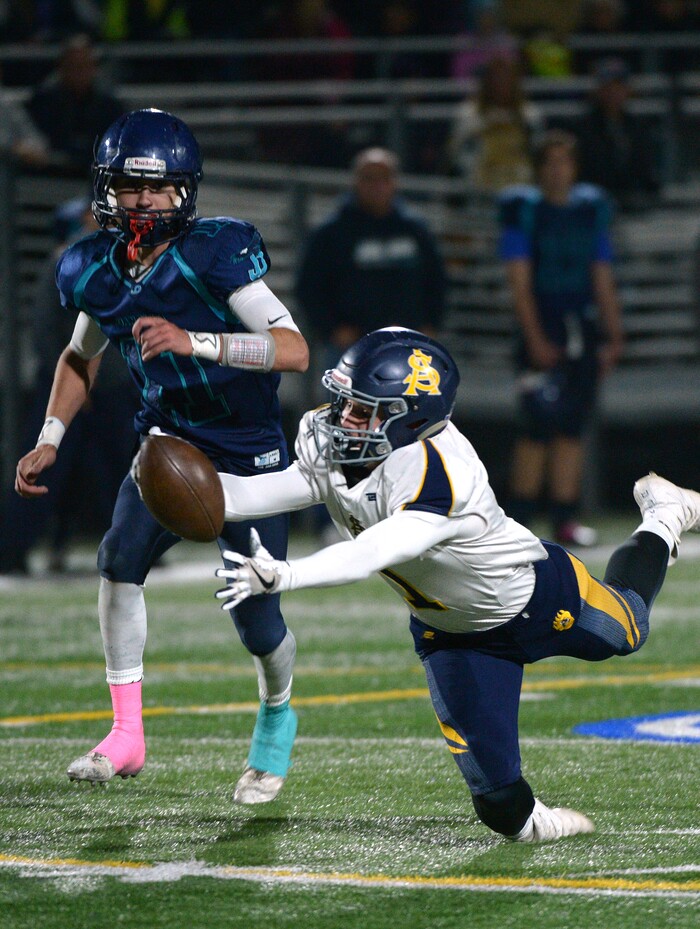 (Leah Hogsten | The Salt Lake Tribune) Summit Academy's Parker Clawson can't pull in the pass. Summit Academy boys' football team leads Juan Diego High School 51-43 during their game, October 13, 2017 in Draper.
