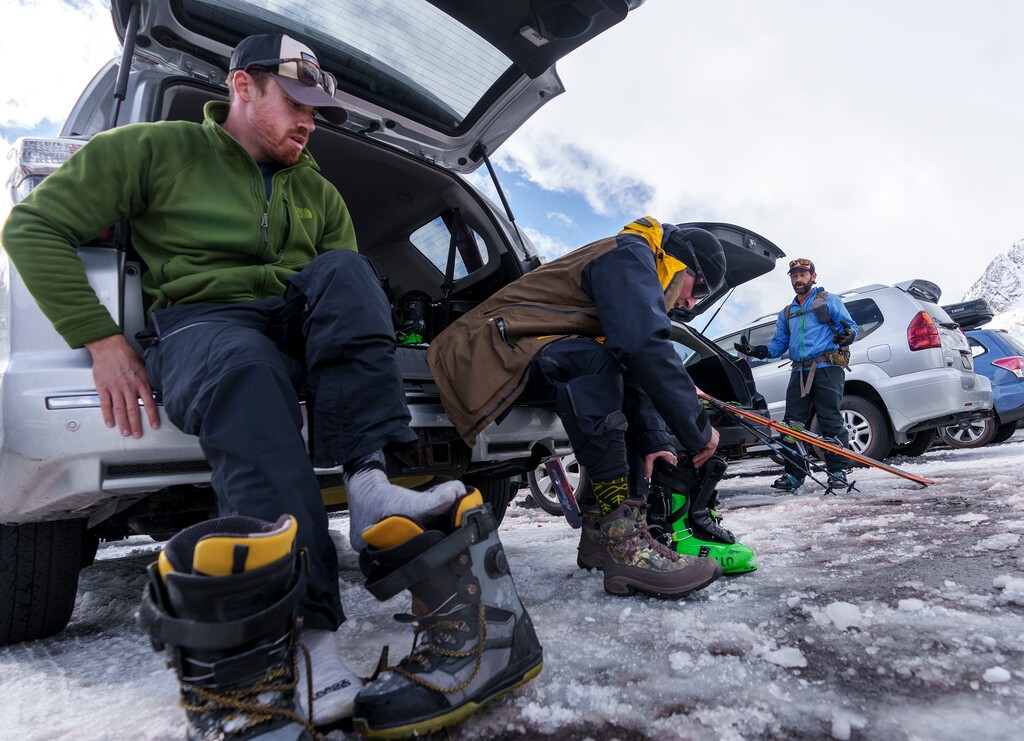 (Leah Hogsten | The Salt Lake Tribune) l-r Snowboarder Stephen Marshall, Brighton ski patrol Billy Treacy and Chris Adams, board president of Wasatch Backcountry Alliance discuss the new parking charges affecting skiers at Alta this winter in the parking lot of Goldminer's Daughter, Nov. 10, 2021. "I think everyone can agree that there's a problem," said Adams. "There should be an incentive to carpool." The Town of Alta has announced it will charge $25 for a permit to park in one of the lots it controls in town on the weekends this winter. That announcement combined with the Alta Ski Resort's previous announcement that it would charge $25 for parking in its lots on weekends means it will not be possible to visit the town on any weekend 2021 winter without having to pay or take the bus.
