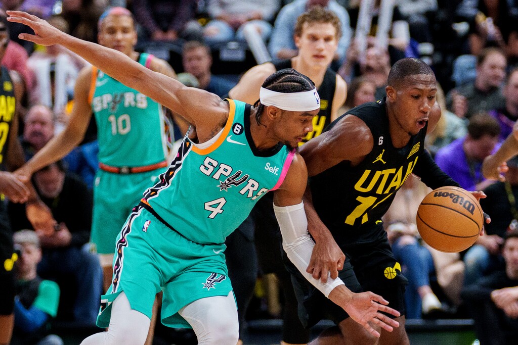 (Trent Nelson  |  The Salt Lake Tribune) Utah Jazz guard Kris Dunn (11) steals the ball from San Antonio Spurs guard Devonte' Graham (4) as the Utah Jazz host the San Antonio Spurs, NBA basketball in Salt Lake City on Saturday, Feb. 25, 2023.