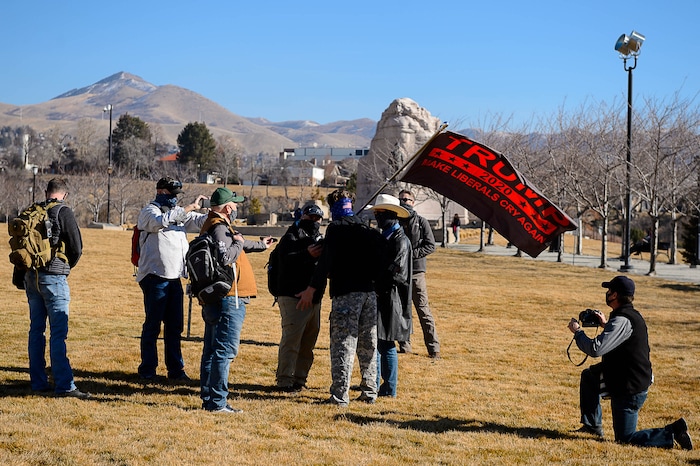 (Trent Nelson | The Salt Lake Tribune) Journalists outnumber a pair of Trump supporters at the state Capitol in Salt Lake City on Sunday, Jan. 17, 2021.