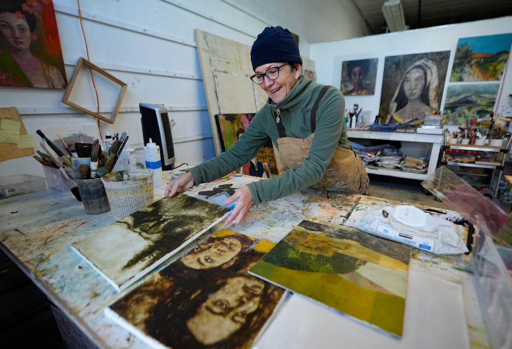 (Francisco Kjolseth | The Salt Lake Tribune) Artist Stacy Phillips works in her studio space inside the Poor Yorick Studios in South Salt Lake on Tuesday, October. 31, 2023. Phillips, a Golden Paints educator and Art to Life coach, is a full-time artist renting space within the visual arts center that is made up of over 40 studios.