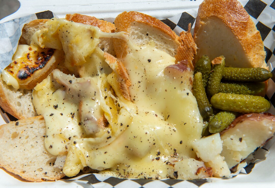 (Rick Egan  |  The Salt Lake Tribune)  "The Alpine" bread and vegetables with melted raclette cheese, in the Raclette Machine food truck, Wednesday, June 26, 2019. The food truck will be part of the Food Truck and Brewery Battle at The Gateway on Aug. 3.