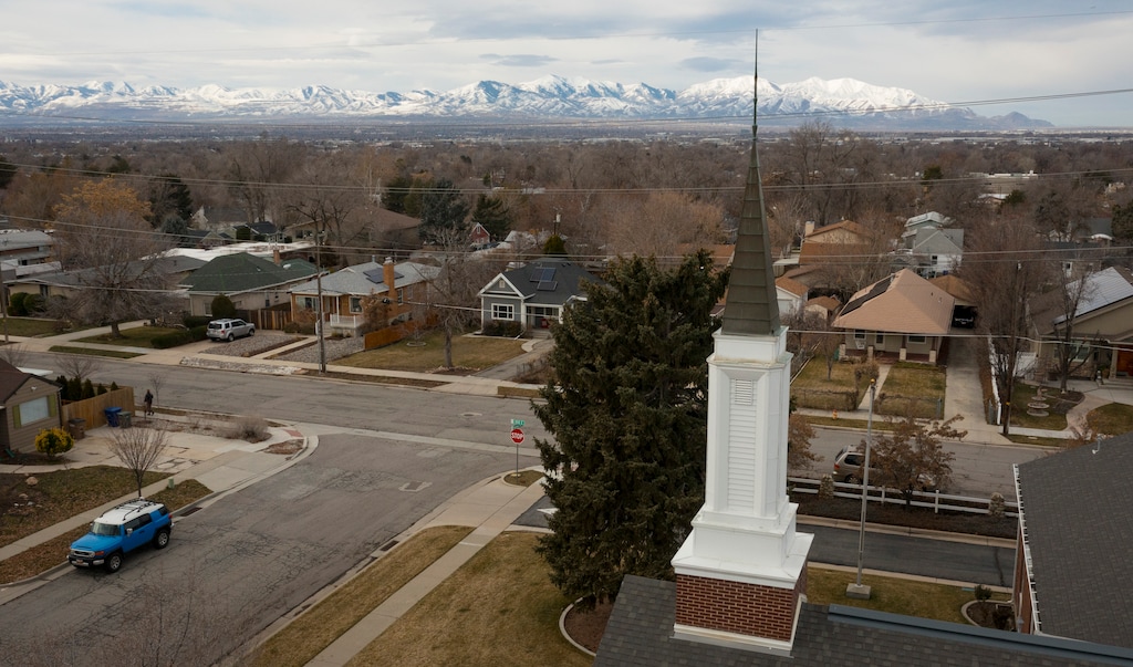 (Bethany Baker | The Salt Lake Tribune) The steeple of a chapel for The Church of Jesus Christ of Latter-day Saints is surrounded by homes in Salt Lake City on Monday, Feb. 19, 2024. The Tribune is seeking reader input on relationships between Latter-day Saints and those not of their faith in Utah neighborhoods.