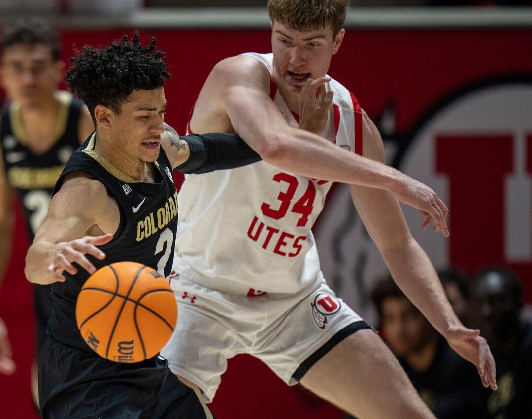 (Rick Egan | The Salt Lake Tribune) Utah Utes center Lawson Lovering (34) gets tangled up with Colorado Buffaloes guard KJ Simpson (2), in PAC-12 basketball action between the Utah Utes and the Colorado Buffaloes a the Jon M. Huntsman Center, on Saturday, Feb. 3, 2024.