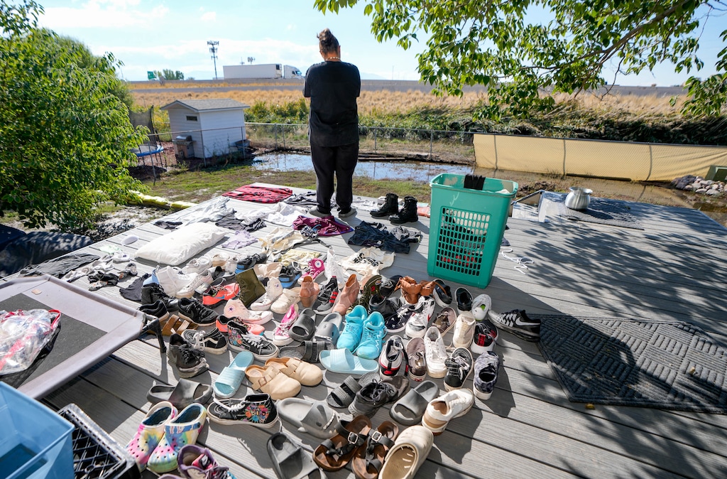 (Francisco Kjolseth | The Salt Lake Tribune) Alissa Cortez overlooks the standing water that remains in her backyard as her family tries to dry out following Saturday’s flooding in her neighborhood along Sir Philip Drive in Salt Lake City, Monday, Oct. 6, 2025.