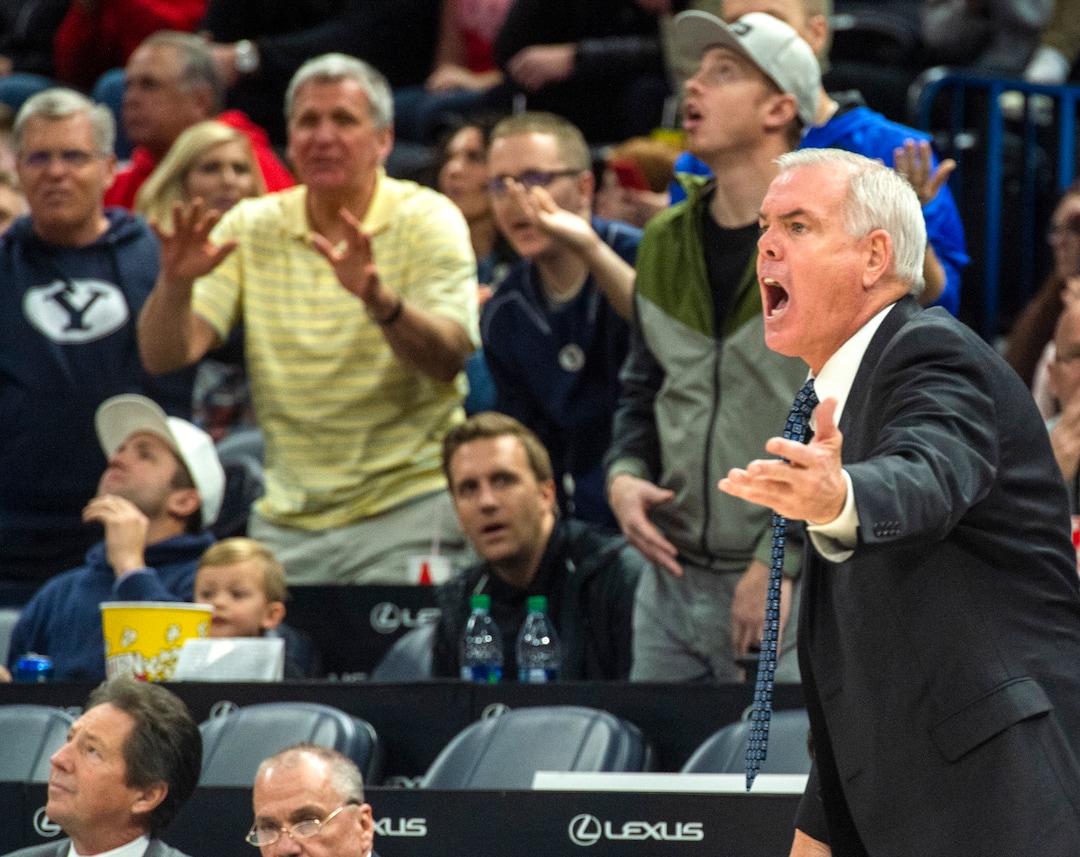 (Rick Egan  |  The Salt Lake Tribune)   Brigham Young Cougars head coach Dave Rose yells at the official, in basketball action in the Beehive Classic, between against the Brigham Young Cougars and Utah Utes, at the Vivint Smart Home Arena, Saturday December 8, 2018.