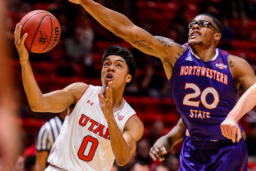 Utah guard Sedrick Barefield (0) drives to the basket as Northwestern State forward Ishmael Lane (20) during an NCAA college basketball game in Salt Lake City, Wednesday, Dec, 20, 2017. (Trent Nelson/The Salt Lake Tribune via AP)