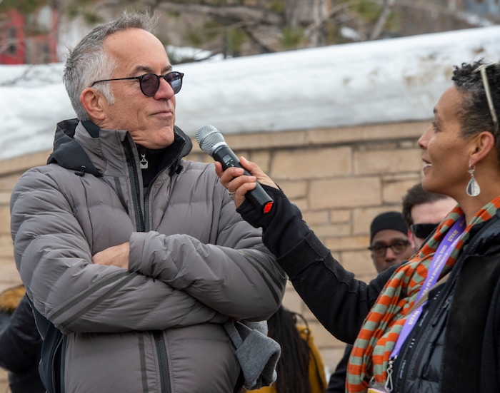 (Rick Egan  |  The Salt Lake Tribune)      Sundance Film Festival Director, John Cooper, is interviewed by Tabitha Jackson, at the Sundance bonfire community gathering on Swede Alley, in Park City, Thursday, Jan. 30, 2020.