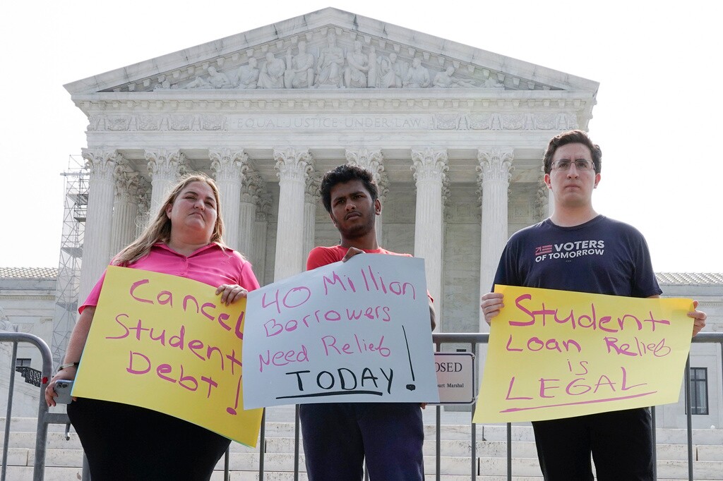 (Mariam Zuhaib | AP Photo) People in favor of canceling student debt protest outside the Supreme Court, Friday, June 30, 2023. The court rejected President Joe Biden’s loan forgiveness plan, but a new income-driven repayment plan stands to lower borrowers' monthly payments.