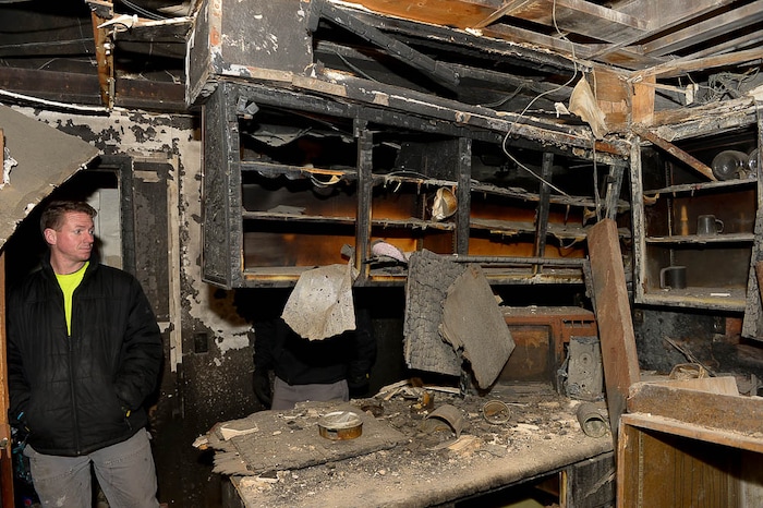 (Trent Nelson | The Salt Lake Tribune) Jordon Holdaway in a dilapidated, fire-damaged building near 100 South 700 East in Salt Lake City, Thursday Feb. 15, 2018. Other Side Academy has received approval to demolish it for their expansion.