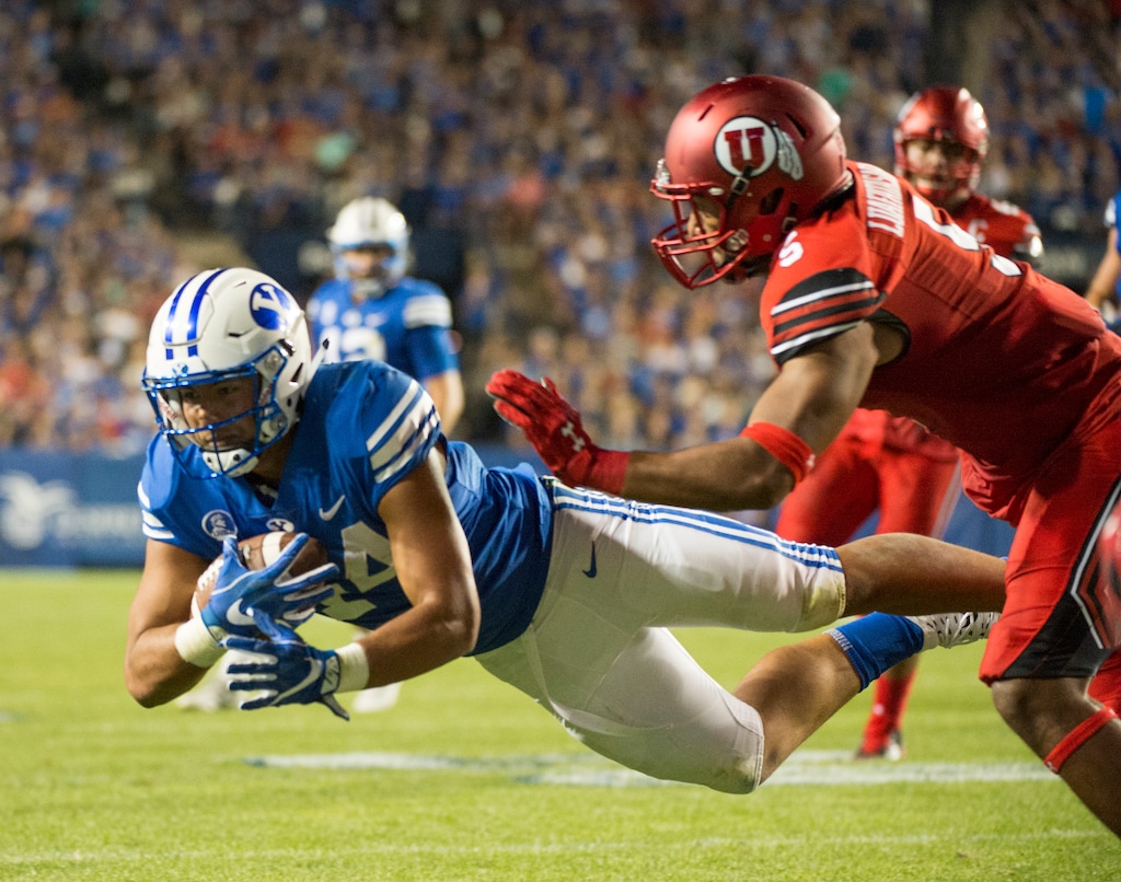 (Rick Egan  |  The Salt Lake Tribune)   Brigham Young running back Kavika Fonua (44) makes a catch for the Cougars,  as Utah Utes linebacker Kavika Luafatasaga (5) defends in football action BYU vs Utah, at LaVell Edwards Stadium in Provo, Saturday, September 9, 2017. Fonua has been moved to linebacker as BYU coaches search for Sione Takitaki's replacement in the middle.