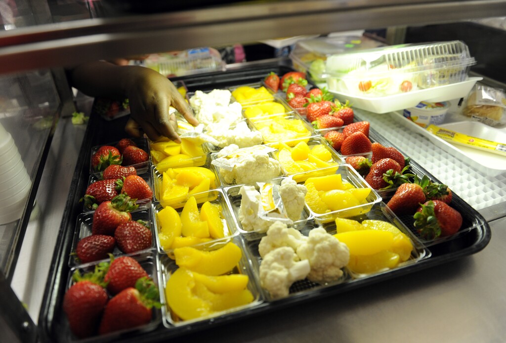FILE - In this April 29, 2014, file photo, fruit and vegetables are served during lunch at the Patrick Henry Elementary School in Alexandria, Va. Congress will have to decide soon whether it wants another food fight with first lady Michelle Obama and the administration over what's served in the school lunch line. School food rules pitted Republicans seeking full exemptions for some schools against Obama in 2014, with the first lady declaring she'd fight "to the bitter end" to make sure kids have good nutrition. (AP Photo/Susan Walsh, File)
