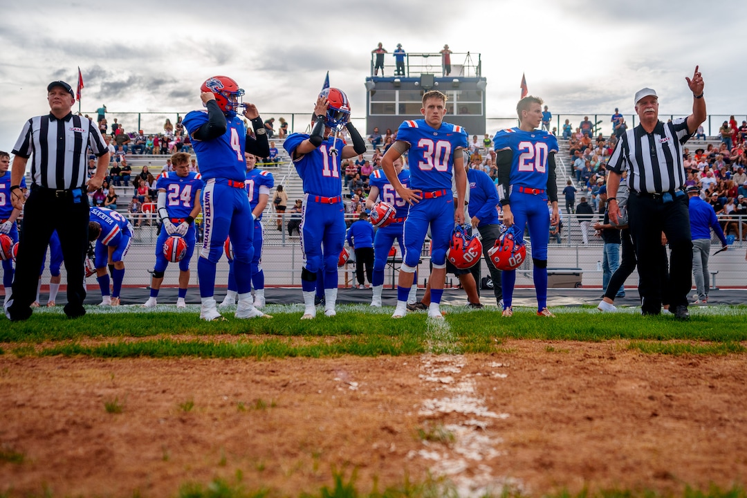 (Trent Nelson  |  The Salt Lake Tribune) Team captains for Water Canyon High School line up for the coin toss, before facing Grand County in Hildale on Friday, Aug. 12, 2022. From left are Dylan Horsley, Nick Timpson, Lester Barlow, and Johnny Timpson.