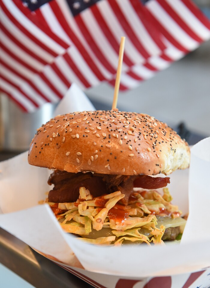 (Francisco Kjolseth | The Salt Lake Tribune) Special Courses, a military-themed restaurant in the dining terrace at The Shops at South Town in Sandy, specializes in burgers, including the "Hell Fire," with pepper jack, chipotle slaw, bacon, jalapeos, sriracha and private sauce. Staff Sgt. James Veylupek, the owner, got help launching the eatery after winning Taste for the Space in May 2017. The veteran, who previously ran the Special Courses food truck, defeated 12 other chefs to get $50,000 and six months free rent in the mallÕs dining terrace.