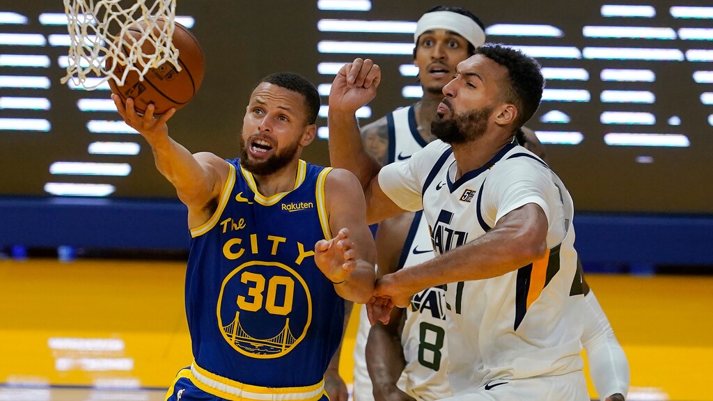 Golden State Warriors guard Stephen Curry (30) shoots against Utah Jazz center Rudy Gobert during the second half of an NBA basketball game in San Francisco, Monday, May 10, 2021. (AP Photo/Jeff Chiu)