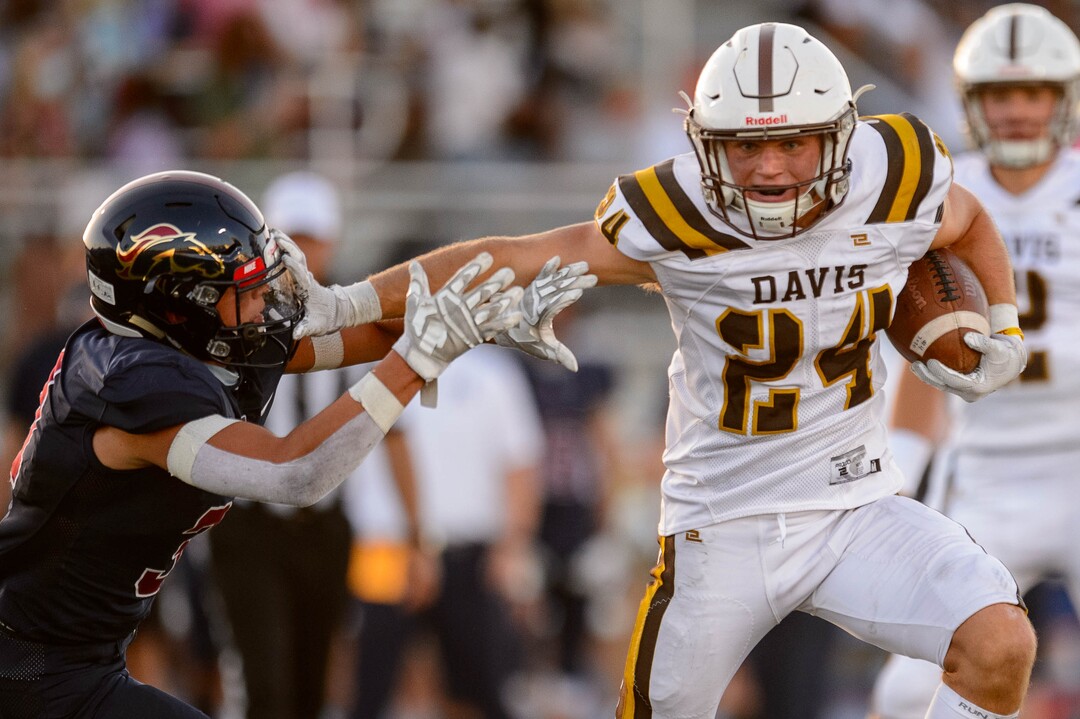 (Trent Nelson  |  The Salt Lake Tribune) Davis running back Spencer Ferguson runs for a touchdown as Herriman hosts Davis High School football, in Herriman on Thursday, Aug. 13, 2020.