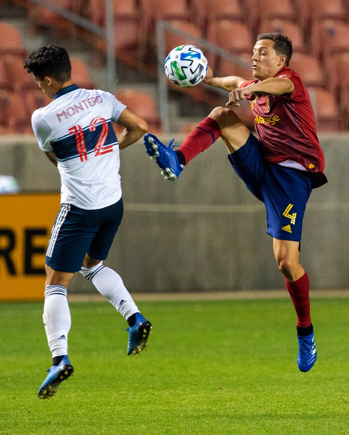 (Rick Egan  |  The Salt Lake Tribune) Real Salt Lake defender Donny Toia (4) kicks the ball as Vancouver Whitecaps forward Fredy Montero (12) defends, in MLS soccer action between Real Salt Lake and the Vancouver Whitecaps at Rio Tinto Stadium on Saturday, Sept. 19, 2020.

 