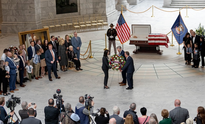 (Francisco Kjolseth | The Salt Lake Tribune) Lt. Gov. Deidre Henderson, State Treasurer Marlo Oaks and Senate President Stuart Adams place a wreath alongside the casket carrying former U.S. Sen. Orrin Hatch during a public viewing at the Utah Capitol on Wednesday, May 4, 2022. Hatch, the longest-serving Republican senator in U.S. history and the longest-serving from Utah, died April 23 at age 88.