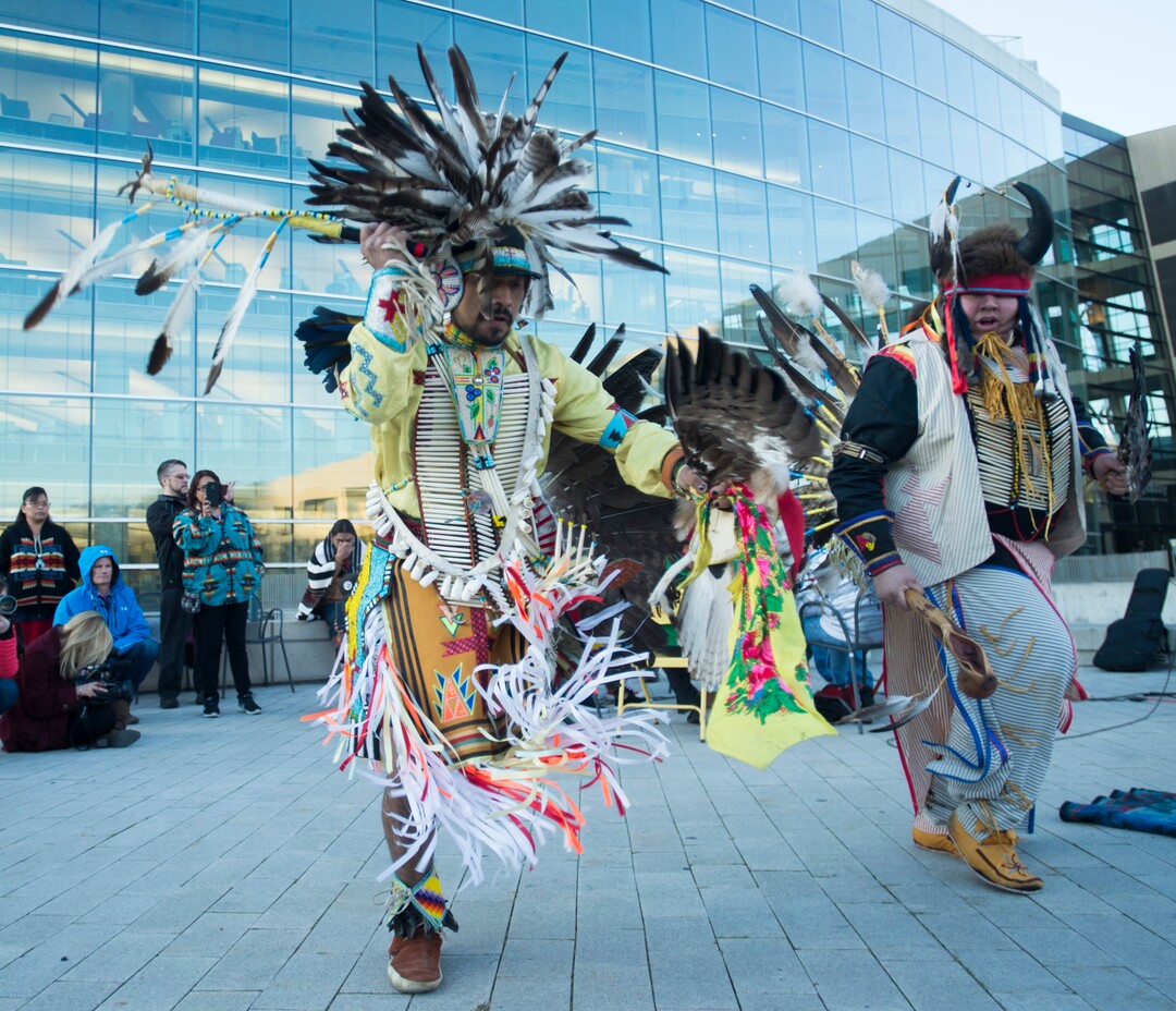 (Rick Egan  |  The Salt Lake Tribune)  Carl Moore, and Mason Runthrough performs a dance, during the Indigenous Peoples Day celebration, hosted by the Utah League of Native American Voters and PANDOS (Peaceful Advocates for Native Dialogue and Organizing Support) at the Salt Lake City Library, Monday, October 9, 2017.