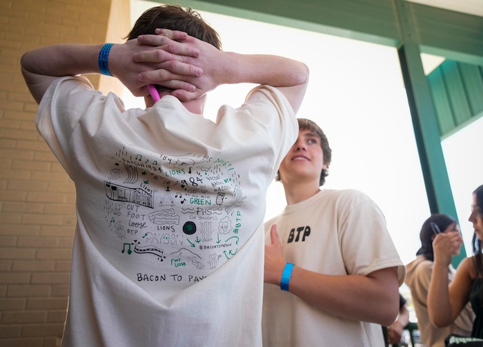 (Bethany Baker | The Salt Lake Tribune) Students wait for Kevin Bacon at a door to Payson High School after a charity event to commemorate the 40th anniversary of the movie "Footloose" in Payson on Saturday, April 20, 2024.