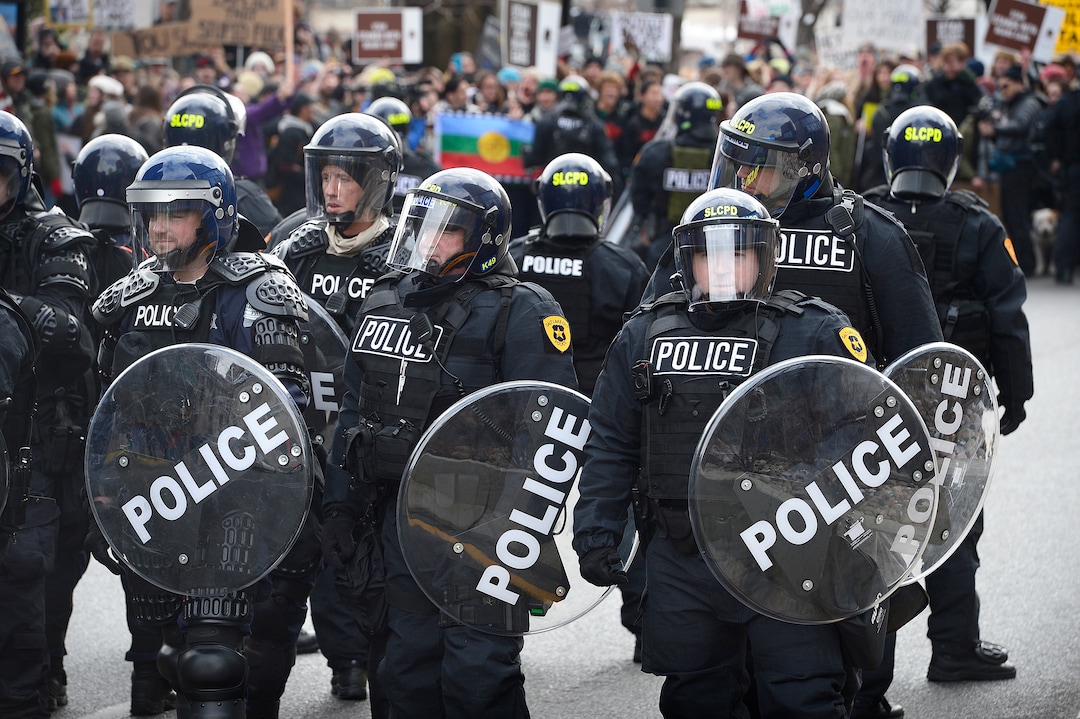 (Scott Sommerdorf   |  The Salt Lake Tribune)   SLCPD confronted protestors as they blocked State Street near 100 South after President Trump's visit to Salt Lake City, Monday, December 4, 2017.  