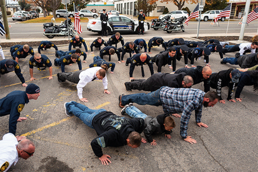 (Trent Nelson  |  The Salt Lake Tribune) 
Men do push-ups to honor Officer Romrell at the dedication ceremony of the David P. Romrell Public Safety Building on Sunday Nov. 24, 2019. The building is named after Officer Romrell, who was killed in the line of duty on Nov. 24, 2018 - one year ago.
