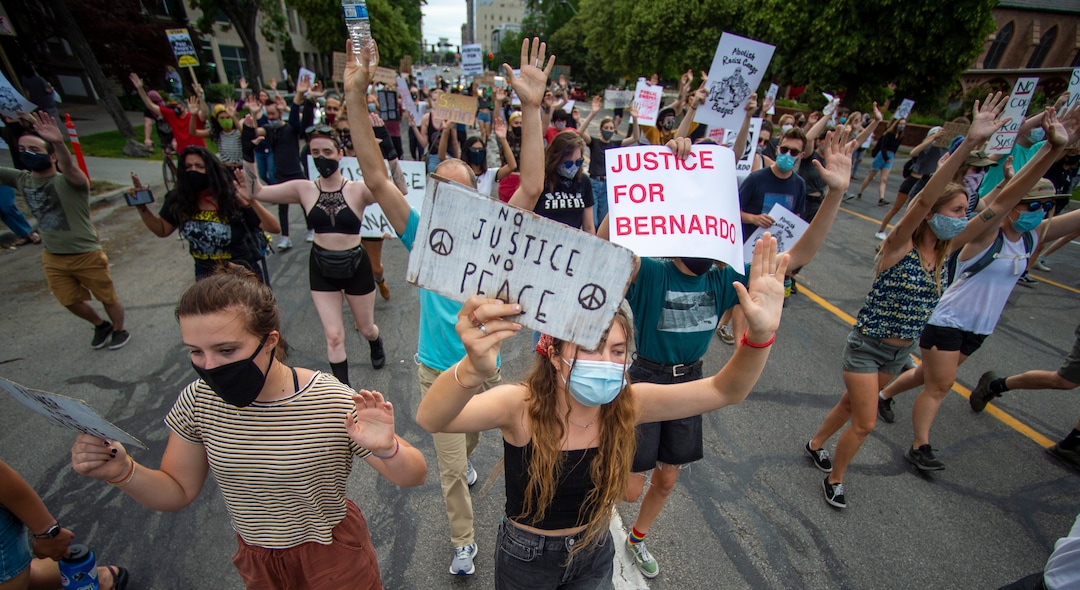 (Rick Egan  |  The Salt Lake Tribune)     Protesters shout "hands up don't shoot" asa they march down the street in Salt Lake City, during a Justice for Bernardo rally on Thursday, June 25, 2020.