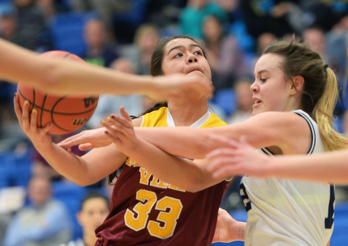 Steve Griffin  |  The Salt Lake TribuneMountain View's Ariana Kailiponi (33) gets fouled by Salem Hills's Lauren Gustin (12) during second round game in the girl's 4A basketball state tournament at SLCC in Taylorsville, Thursday, February 19, 2015. 