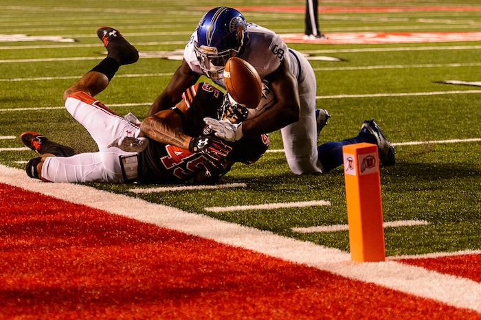 (Trent Nelson | The Salt Lake Tribune) Utah Utes wide receiver Raelon Singleton (11) loses his footing and the ball as San Jose State Spartans linebacker William Ossai (11) closes in as the Utah Utes host the San Jose State Spartans, NCAA football at Rice-Eccles Stadium in Salt Lake City, Saturday September 16, 2017.