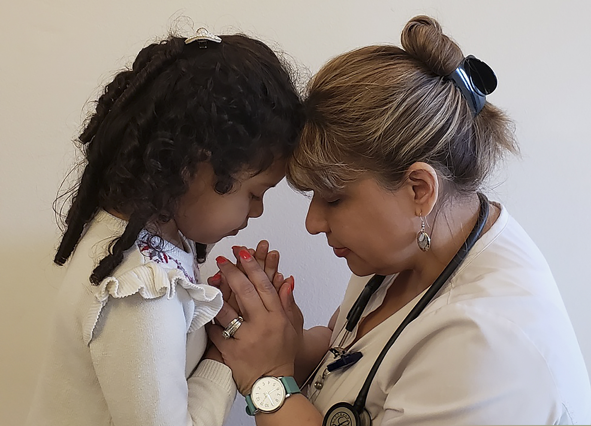 (Cecilia Fabiano | LaPresse | AP) This undated photo shows Katherine Ramos, right, with her 4-year-old daughter Victoria Ramos at their home in Patterson, N.Y. Ramos is one of an army of health care workers that heeded New York's call for help reinforcing hospitals overwhelmed by the coronavirus pandemic. Ramos, of Cape Coral, Florida, is staying with her family in Patterson while she works as a nurse at New York Presbyterian Hospital.