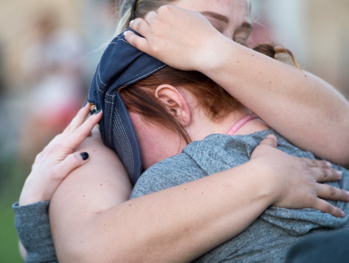 (Rick Egan  |  The Salt Lake Tribune)  Southern Utah University student, Hannah Moyer of Las Vegas (left), gets a hug from Josie Burgess  of Las Vegas, (right) during a candle light vigil for the victims of the Las Vegas shooting, on the SUU campus in Cedar City, Wednesday, October 4, 2017.