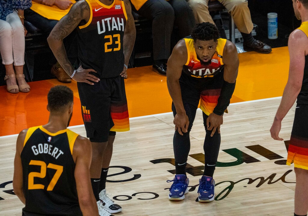 (Rick Egan | The Salt Lake Tribune) Utah Jazz guard Donovan Mitchell (45) is slow getting to his feet after being fouled by LA Clippers guard Paul George (13) in Game 2 of the Western Conference Semifinals at Vivint Arena, on Thursday, June 10, 2021.